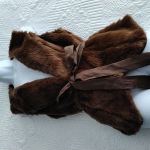 NWOT Available fur vests with belts and hooks on the inside for front closure.